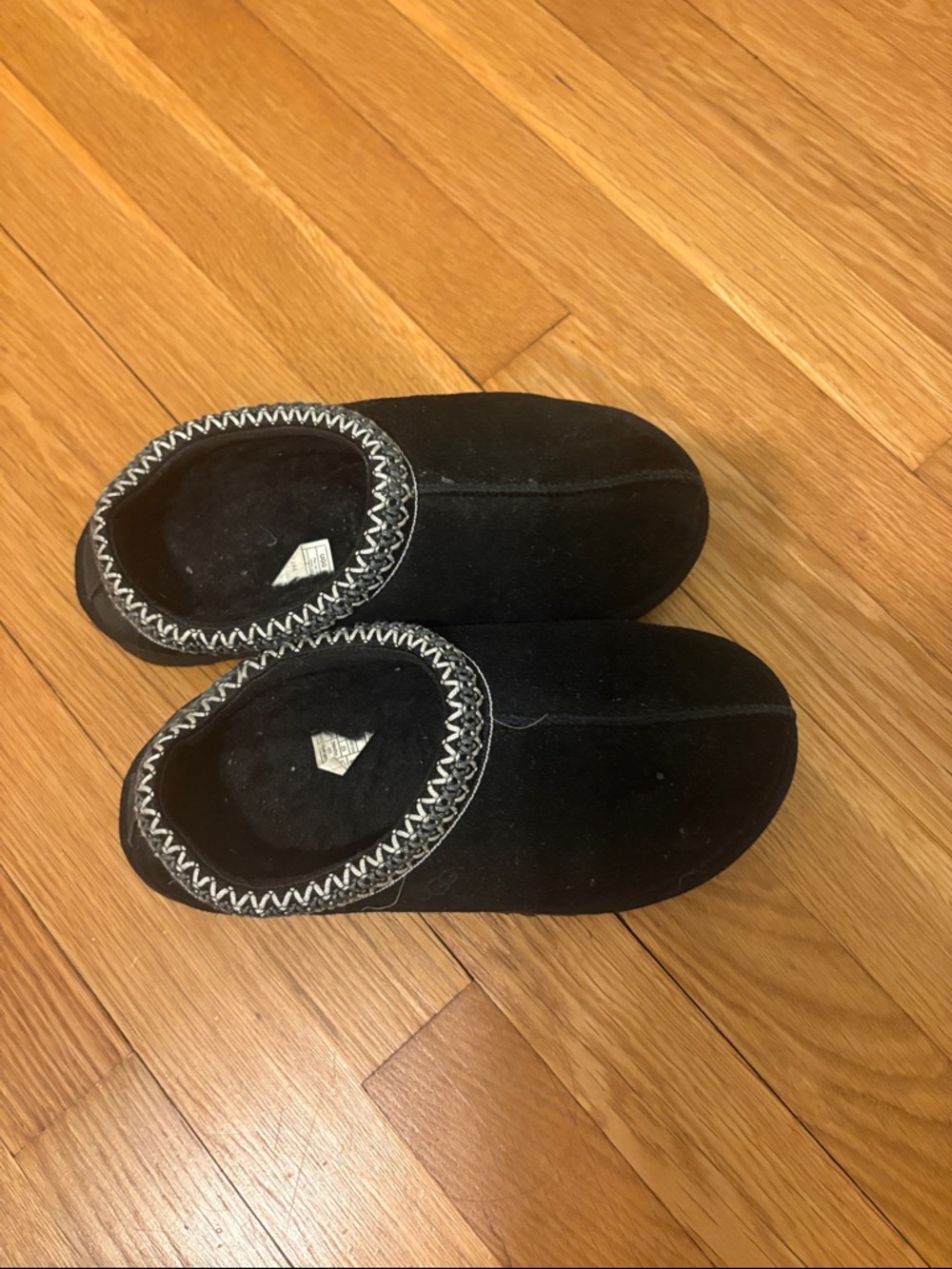 UGG Black Slip-On Moccasin Slippers with White Whipstitch